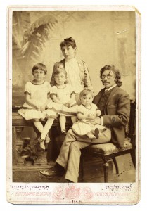 Sholem Aleichem, his wife Olga, and their three children, Tissa, Lyala (Bel Kaufman’s mother), and Emma, Kiev, 1889. The family portrait was used as a Rosh Hashana greeting card (see Hebrew inscription at bottom). (YIVO Archives)